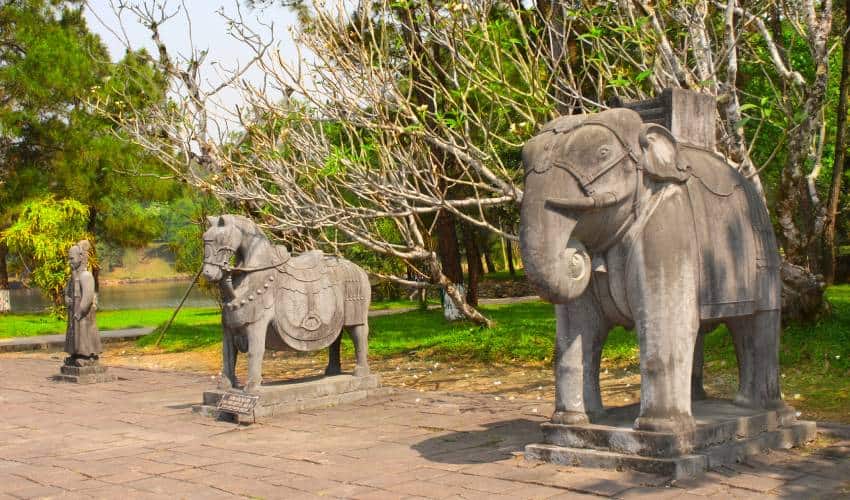 Stone statues of horse, elephant and man in Imperial Minh Mang Tomb